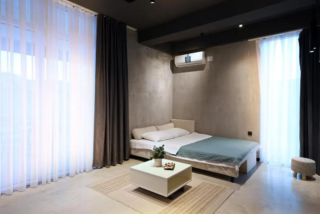 Bedroom with bedside sockets and reading lights