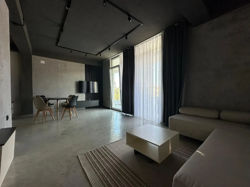 Bedroom with a full-size bed in grey tones