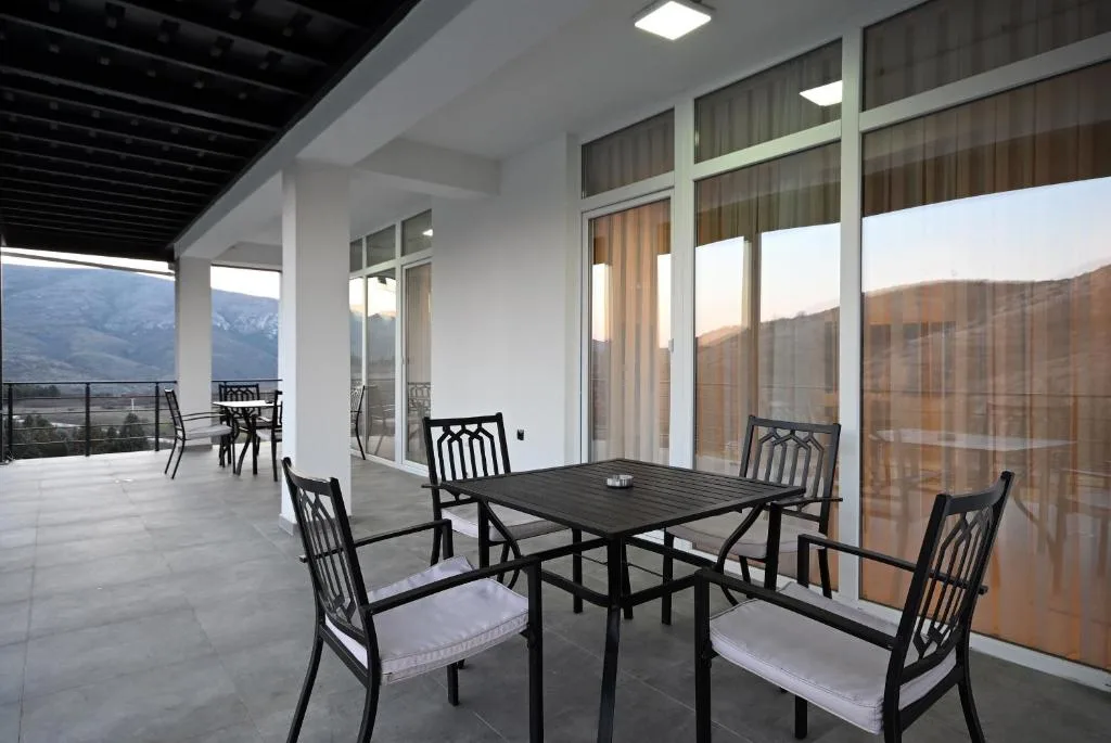 Terrace with outdoor furniture facing the garden