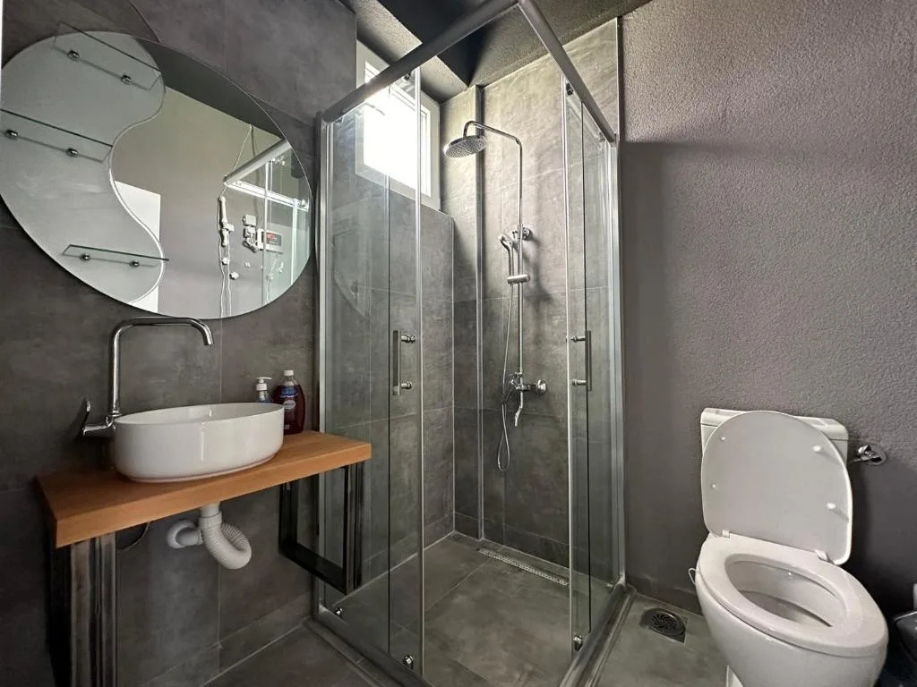 Bathroom with walk-in shower and vanity