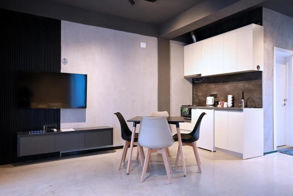 Kitchenette with refrigerator and cupboards