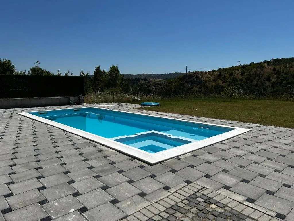 The private outdoor pool with sun loungers