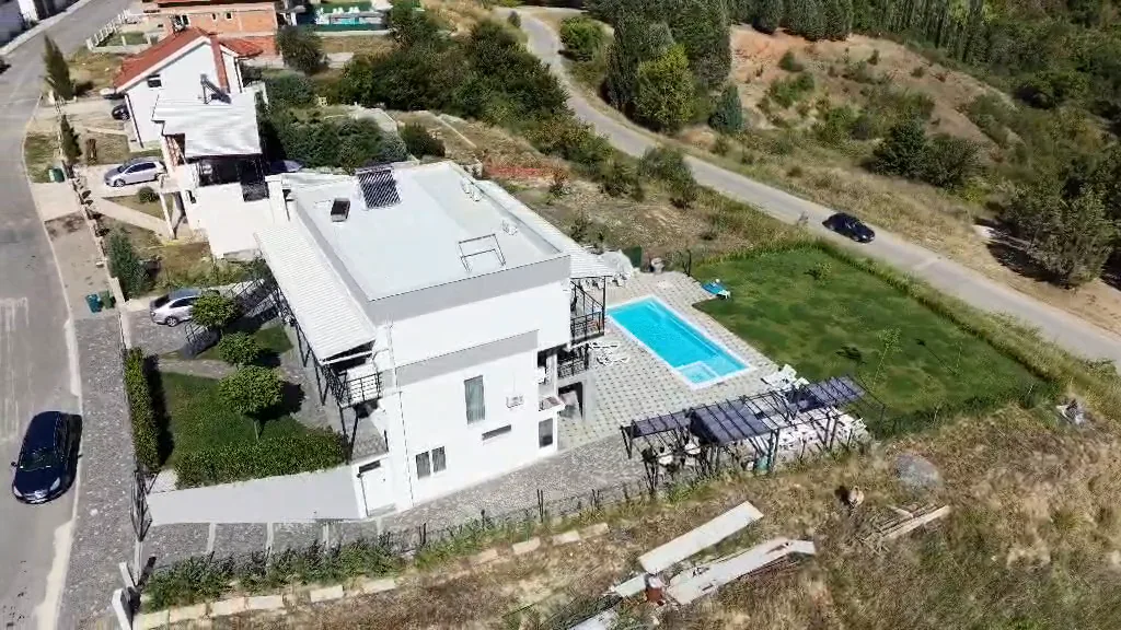 Aerial view of Tashev Apartments, the pool and the garden